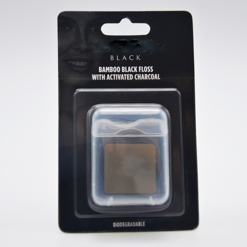 Sabor material de nylon portátil de la menta de 50 metros de la seda dental del carbón de leña del bambú de la etiqueta privada